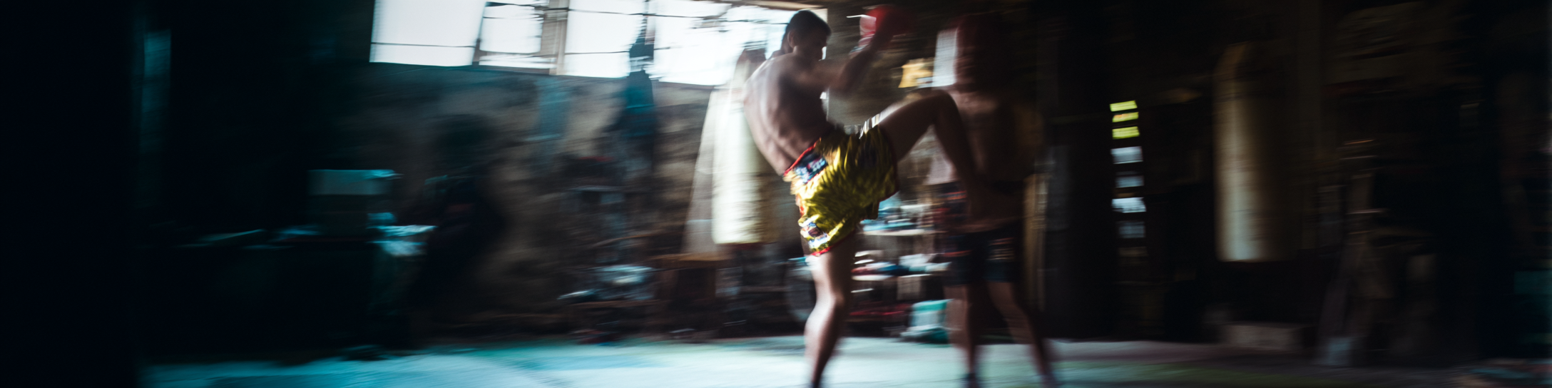 bittahspecialist_cinematic_still_gritty_2000s_Muay_Thai_fight_e991c31a-5ee5-4895-9218-537633cf5167_1.png